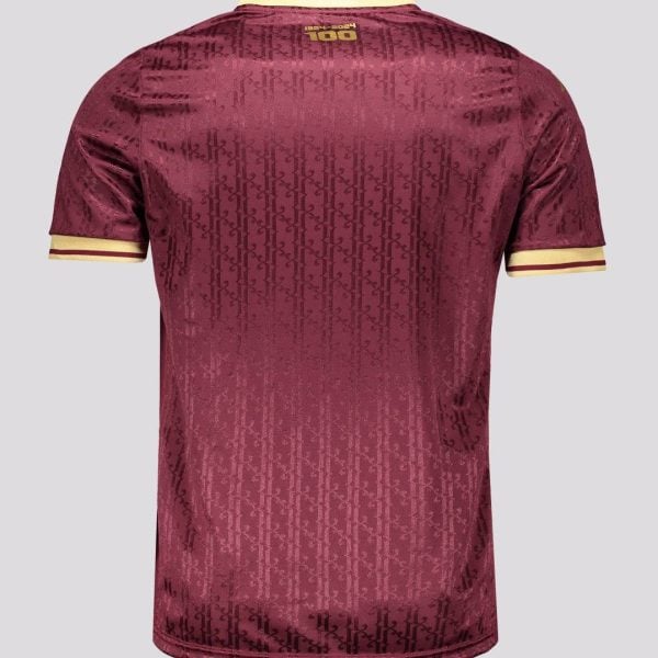 Back view of a maroon polo shirt with yellow trim on the collar and sleeves, featuring a subtle repeating pattern and a small '100' logo near the neck.
