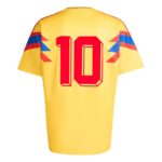 Back view of a yellow sports jersey with a large red number 10 and blue/red chevron stripes on the sleeves.