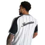 Back view of a man wearing a white pinstripe Juventus soccer jersey with black sleeves.