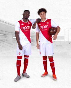 JUUDLLbZEsuNHu5 | UAE SPORT STORE Two soccer players in red-and-white AS Monaco kits pose together on a pale background stadium.