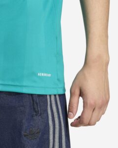 Close-up of turquoise AEROREADY athletic shirt and dark denim shorts with white stripes and Adidas trefoil logo.