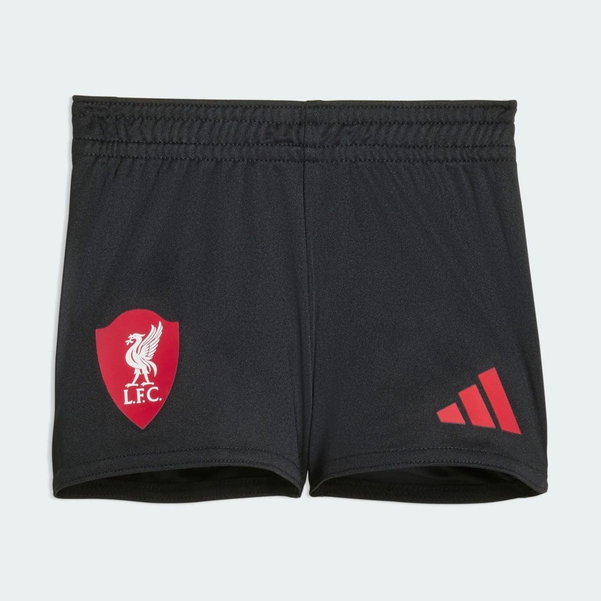 Black athletic shorts featuring a red Liverpool FC crest on the left leg and red Adidas stripes on the right leg edge