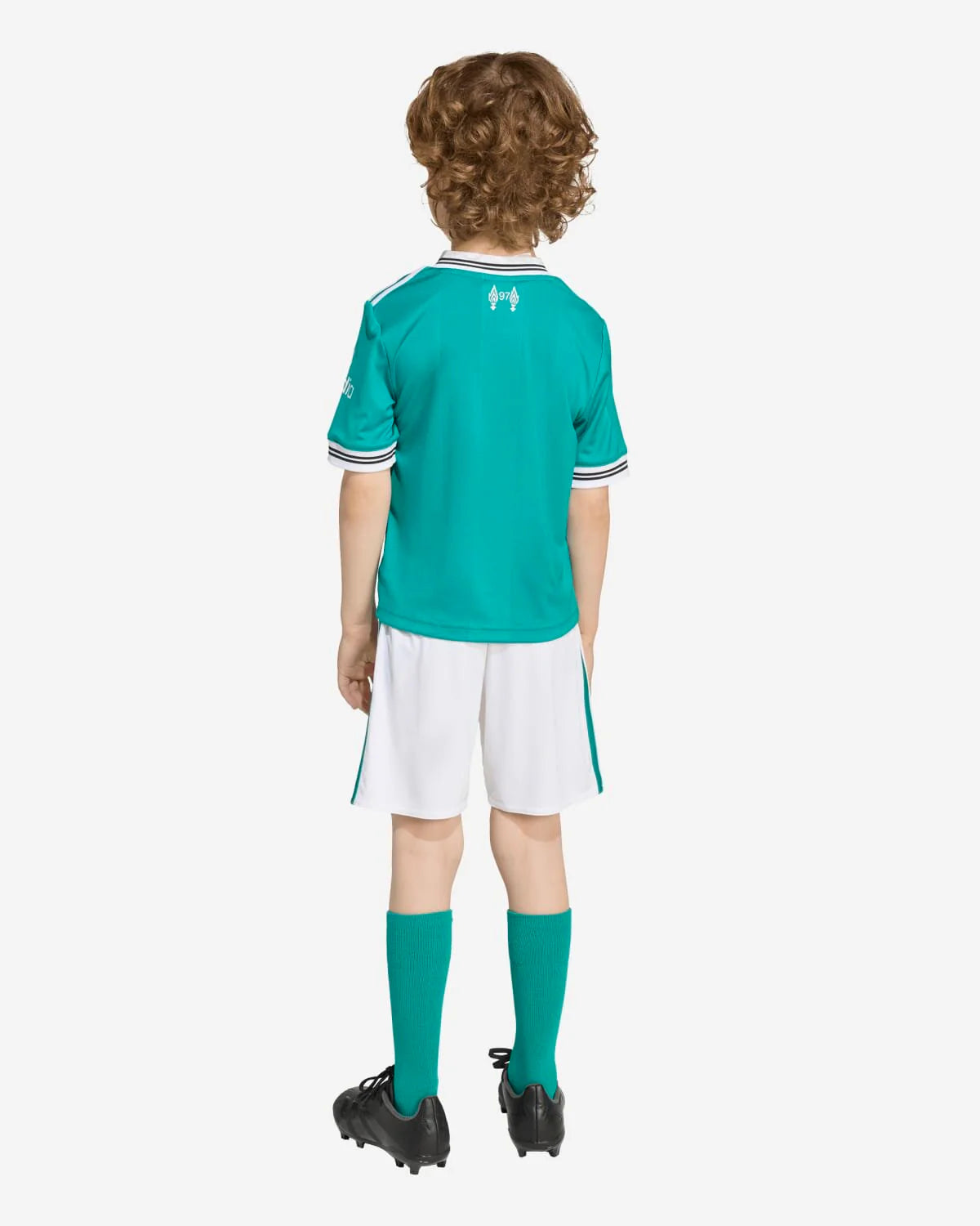 JV6470_3_APPAREL_OnModel_BackView_custom_1-lowres | UAE SPORT STORE Back view of a child wearing a teal soccer jersey with white trim, white shorts, teal socks, and black cleats.