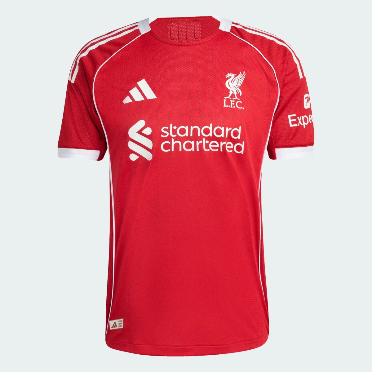 Red Liverpool FC soccer jersey shown from chest up, featuring white crest, Adidas logo, and sponsor text on the front.