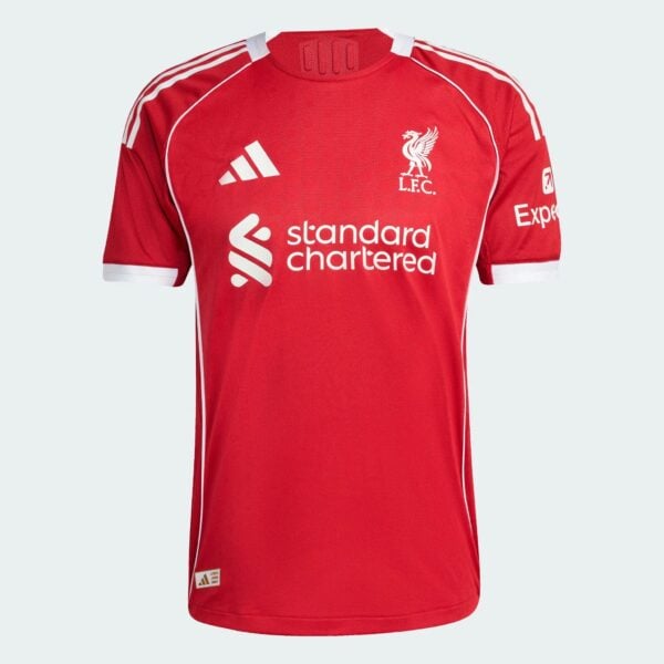 Red Liverpool FC soccer jersey shown from chest up, featuring white crest, Adidas logo, and sponsor text on the front.