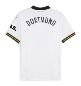 White Borussia Dortmund football jersey back with 'DORTMUND' arced across the shoulders, black collar and striped sleeve cuffs.