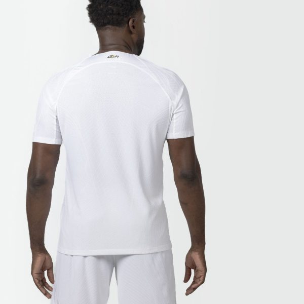 Back view of a man in a white athletic t-shirt and shorts, small logo near the neckline on the back.