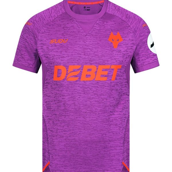 Purple athletic jersey with orange 'DEBET' sponsor across the chest, orange wolf crest on the left chest, and small logos on the shoulders; purple patterned fabric.