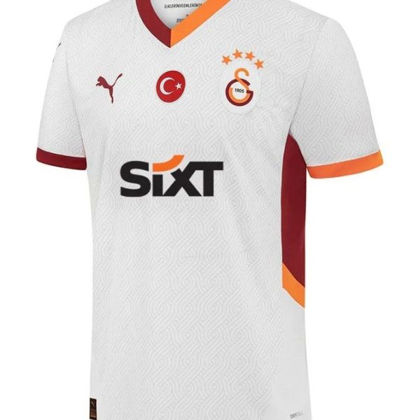 White Galatasaray football jersey with orange and maroon trim, club crest on the chest beside the Turkish flag emblem, sponsor 'Sixt' across the front, and a Puma logo on the opposite side.