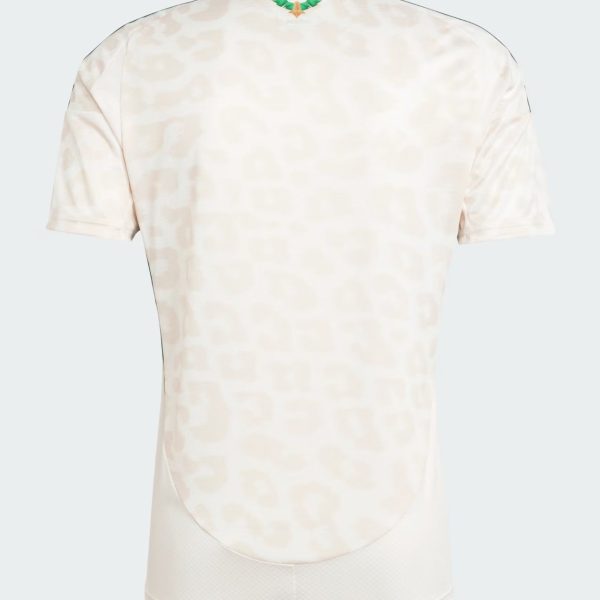 Back view of a pale, patterned polo shirt with a small green-and-orange emblem at the collar.