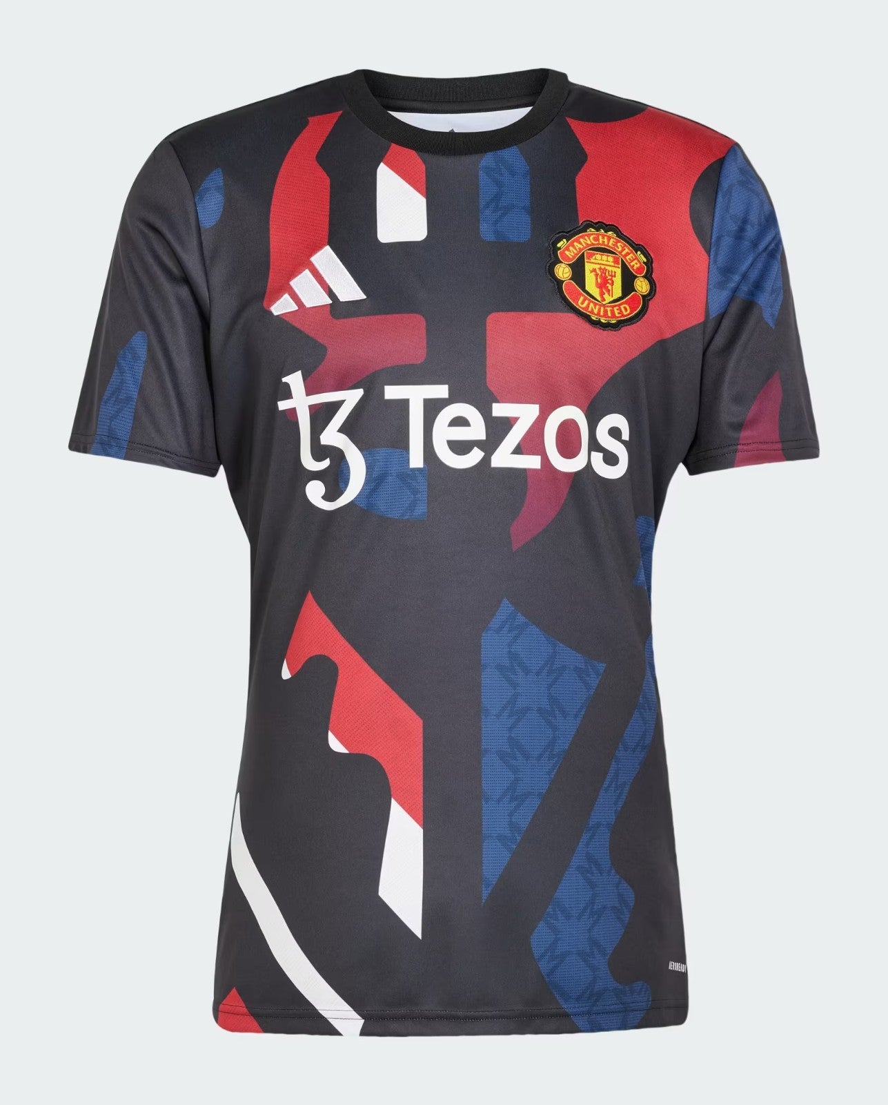 LyKgHM47cG1xBU4 | UAE SPORT STORE Manchester United football jersey featuring Tezos sponsor and red-blue abstract patterns with club crest on the chest
