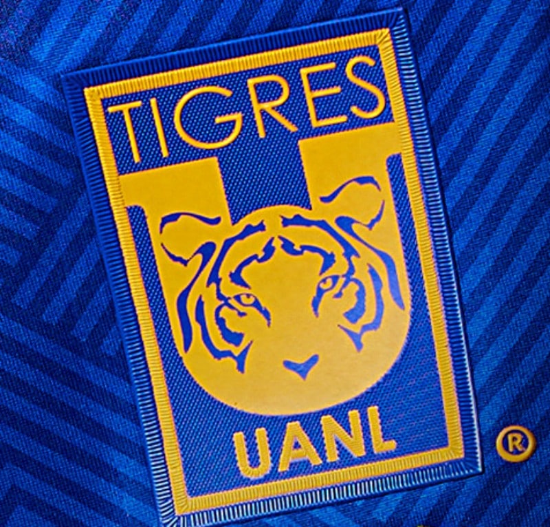 N4uiKkJ3CSnkqZn | UAE SPORT STORE Tigres UANL football club patch with a stylized tiger head on a blue and gold shield.
