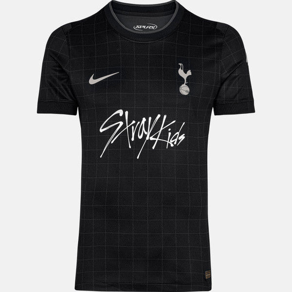 Black Tottenham Hotspur youth football jersey with a subtle grid pattern, featuring a Nike swoosh, club crest, and 'Starkids' sponsor across the chest.