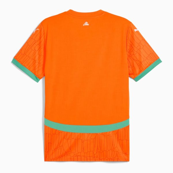 Back view of a bright orange T-shirt with green cuffs and hem, featuring a subtle geometric pattern on the sleeves and a small white logo at the neckline center back.