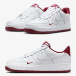 Two white Nike Air Force 1 sneakers with red swoosh and red soles, shown from front and side.