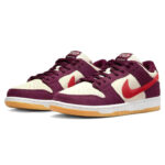Nike-SB-Dunk-Low-Skate-Like-a-Girl-2_720x_47b57dd2-764c-4936-a60c-f7fd8c630bb8 | UAE SPORT STORE Pair of purple and cream sneakers with a red Nike Swoosh, shown from the side with gum-colored outsoles.
