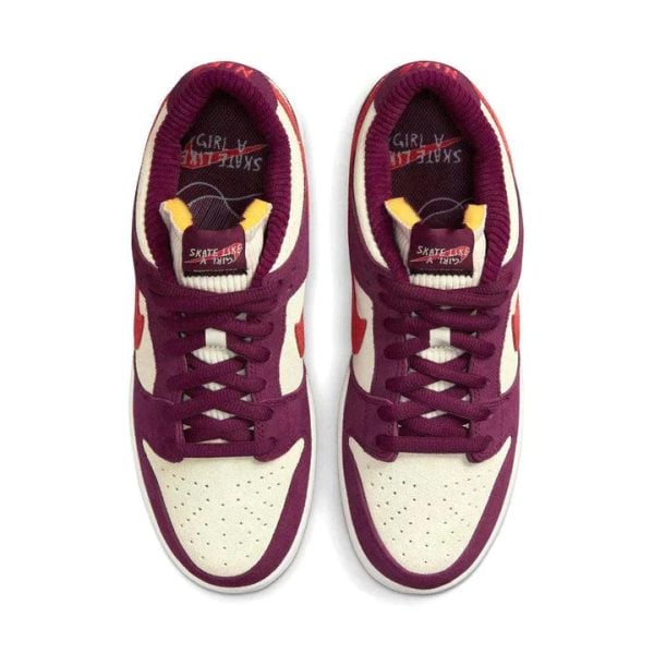 Top-down view of a pair of purple and cream sneakers with maroon laces.