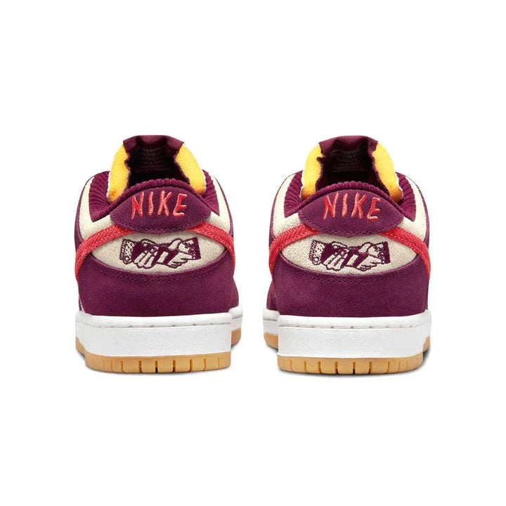 Nike-SB-Dunk-Low-Skate-Like-a-Girl-4_720x_0063763e-f3d6-4f3b-9f1d-6b11fb5a58bd | UAE SPORT STORE Back view of maroon Nike sneakers with yellow lining and gum sole