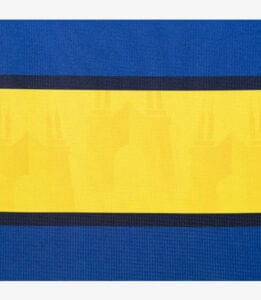 Close-up of a flag-like fabric: blue on top and bottom with a wide yellow center and dark blue seams.