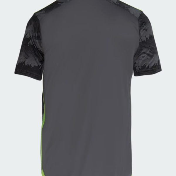 Back view of a dark gray athletic jersey with black camo-pattern sleeves and lime green trim along the hem.