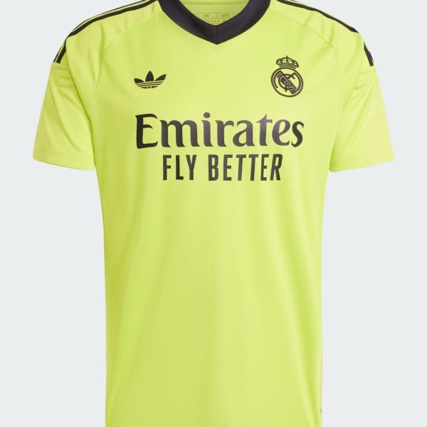 Bright neon-yellow Real Madrid football jersey, front view, featuring Emirates Fly Better sponsor and Real Madrid crest on the chest.