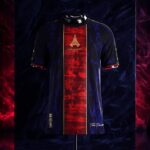 Dark navy jacket on a stand featuring a red patterned center panel with a gold Eiffel Tower motif and 'European Champions' text.