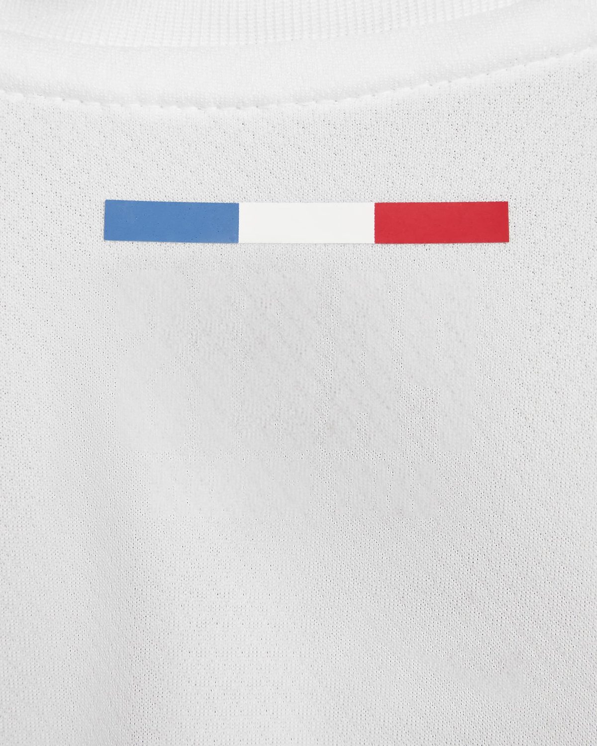 Thin horizontal tricolor bar (blue, white, red) on textured white fabric.