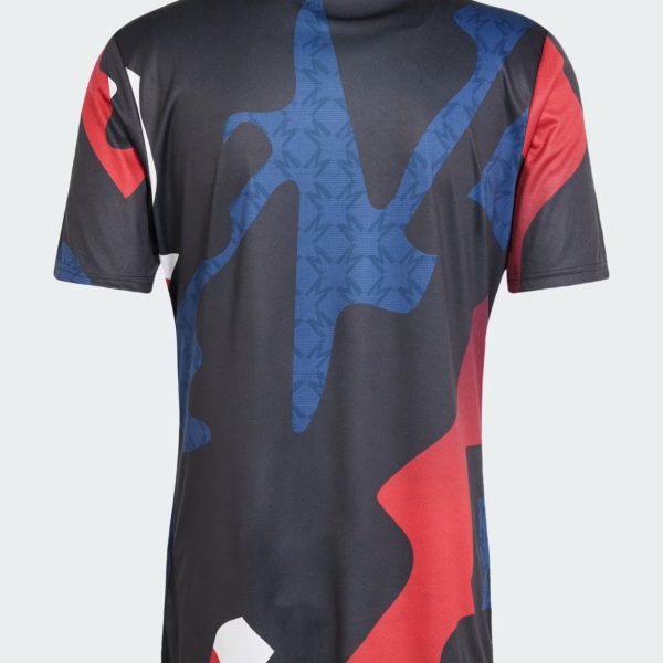 Back view of a black athletic T-shirt with red and blue abstract camouflage pattern on the front-facing side of the back area (short sleeves).