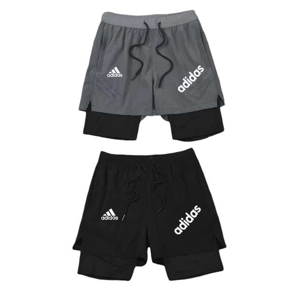 Two Adidas athletic shorts, gray over black with inner layer, featuring white Adidas logos and drawstrings.