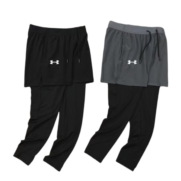 Two-layer athletic pants: black pants with a drawstring, paired with black shorts displaying the Under Armour logo on the left thigh.