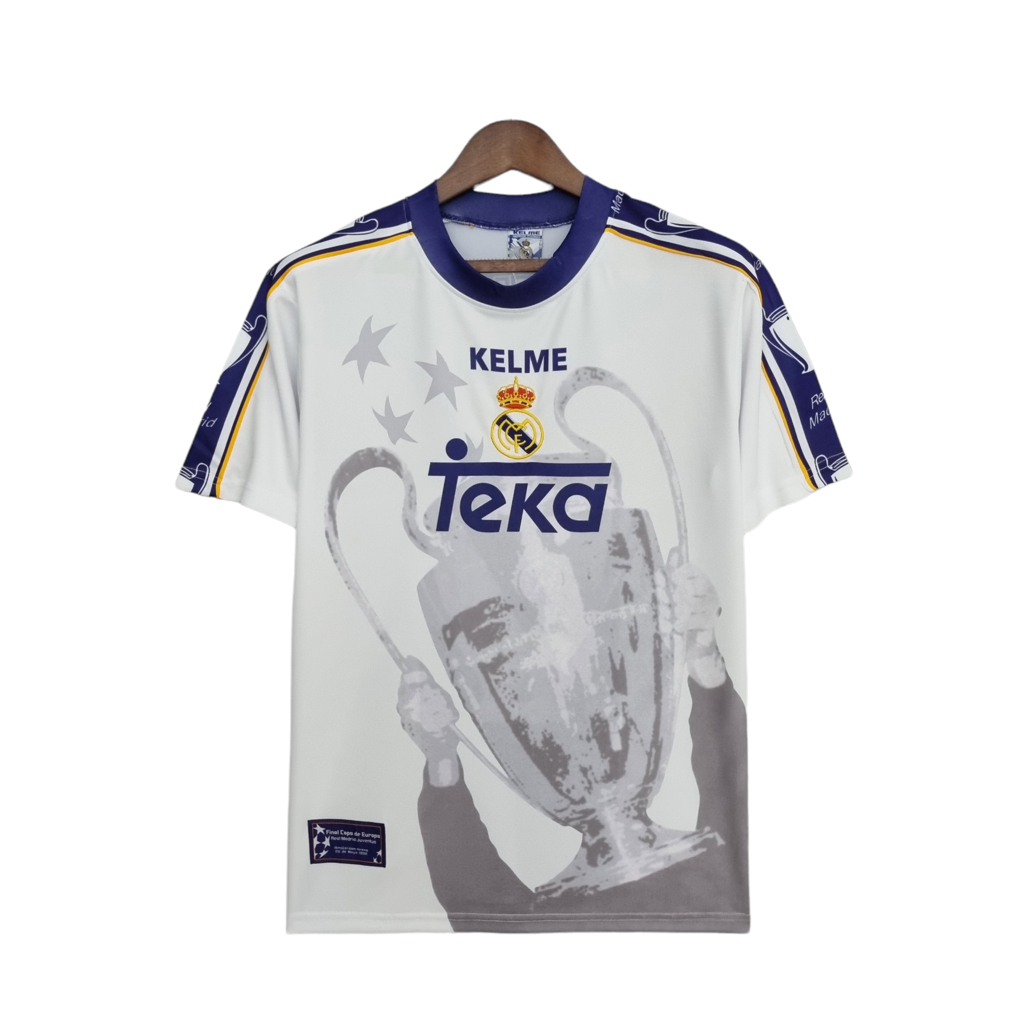 PhotoRoom-20220409_182501_8d971835-9f16-4545-b1a1-4aecdc1664b7 | UAE SPORT STORE White Real Madrid jersey on a wooden hanger with purple collar, yellow trim, crest, and a large grayscale graphic of a player.
