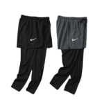 Two-tone Nike athletic pants with overlaid shorts, black and gray, shown side by side and featuring white swoosh logos.