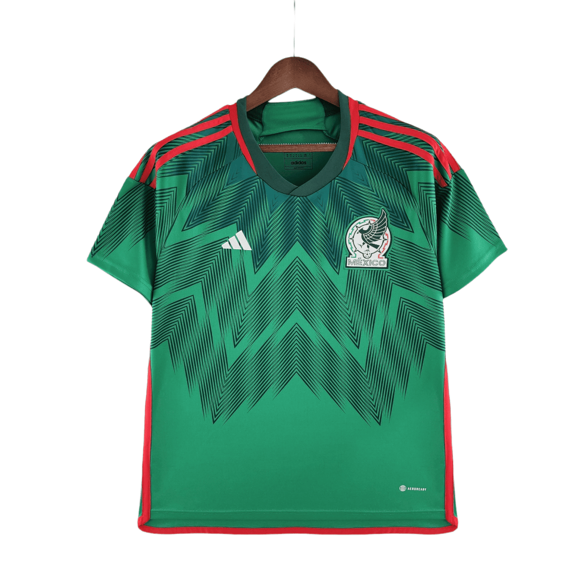 Green Mexico national team jersey with red trim, hanging on a wooden hanger, Adidas logo visible on the chest edge