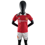PhotoRoom-20220819_013249_2def20a1-53e7-4d40-bd5c-0394d1c2530e | UAE SPORT STORE Mannequin wearing a red Manchester United jersey with white collar and sponsor logos visible on chest and sleeves, standing with hands on hips.