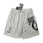 Gray athletic shorts with a white drawstring, featuring an NBA logo patch and a Nike swoosh visible near the hem.