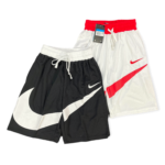 Pair of Nike athletic shorts in black and white with a red waistband and white drawstrings, logo visible on the leg (tag attached).