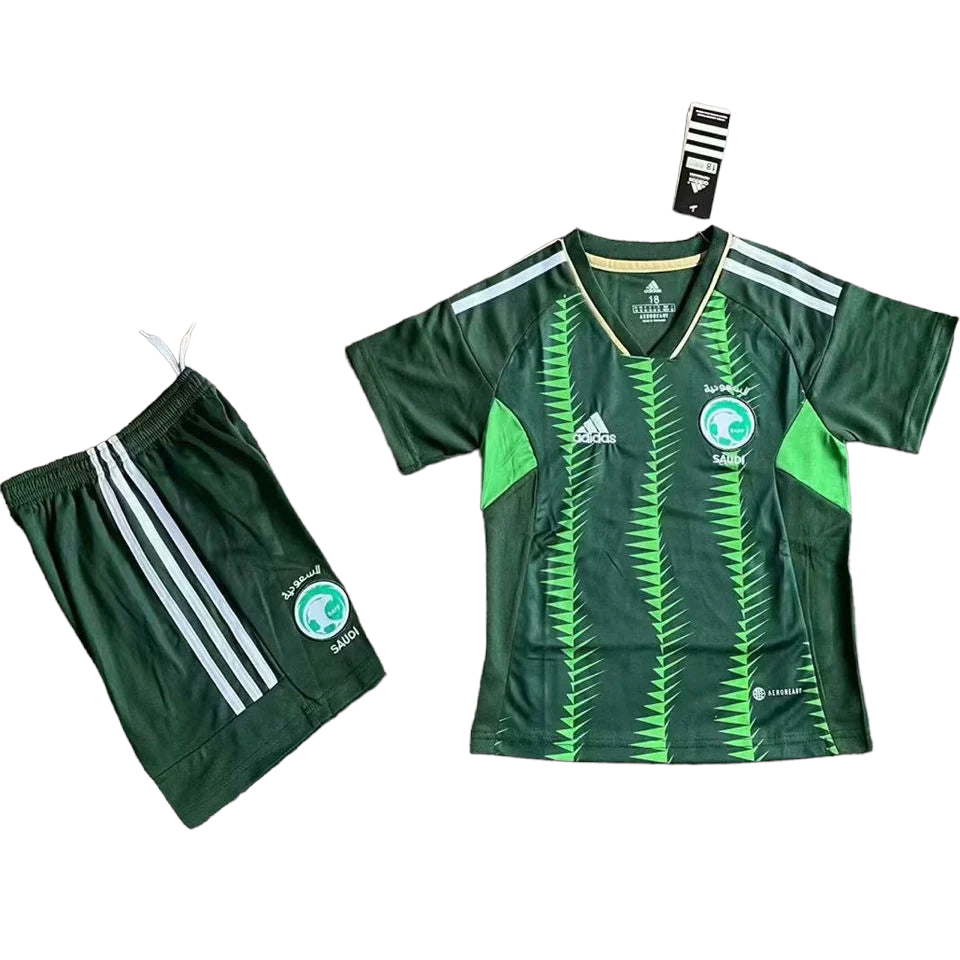 PhotoRoom-20230613_065107_d789283c-2040-4364-8871-aa0198f7e26f Green Saudi Arabian soccer jersey with matching dark green shorts and tag, Adidas branding visible on both pieces.