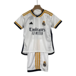 White Real Madrid soccer jersey on a hanger featuring Emirates Fly Better sponsor and club crest with Adidas logo detail on the chest
