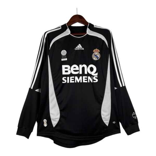 Black Real Madrid goalkeeper jersey with white sponsor text 'BENQ SIEMENS' on the chest, hanging on a wooden hanger with team crest and Adidas logo visible.