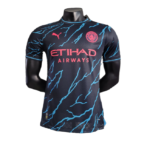 Manchester City soccer jersey on a mannequin: navy kit with pink Etihad Airways sponsor and blue lightning patterns.