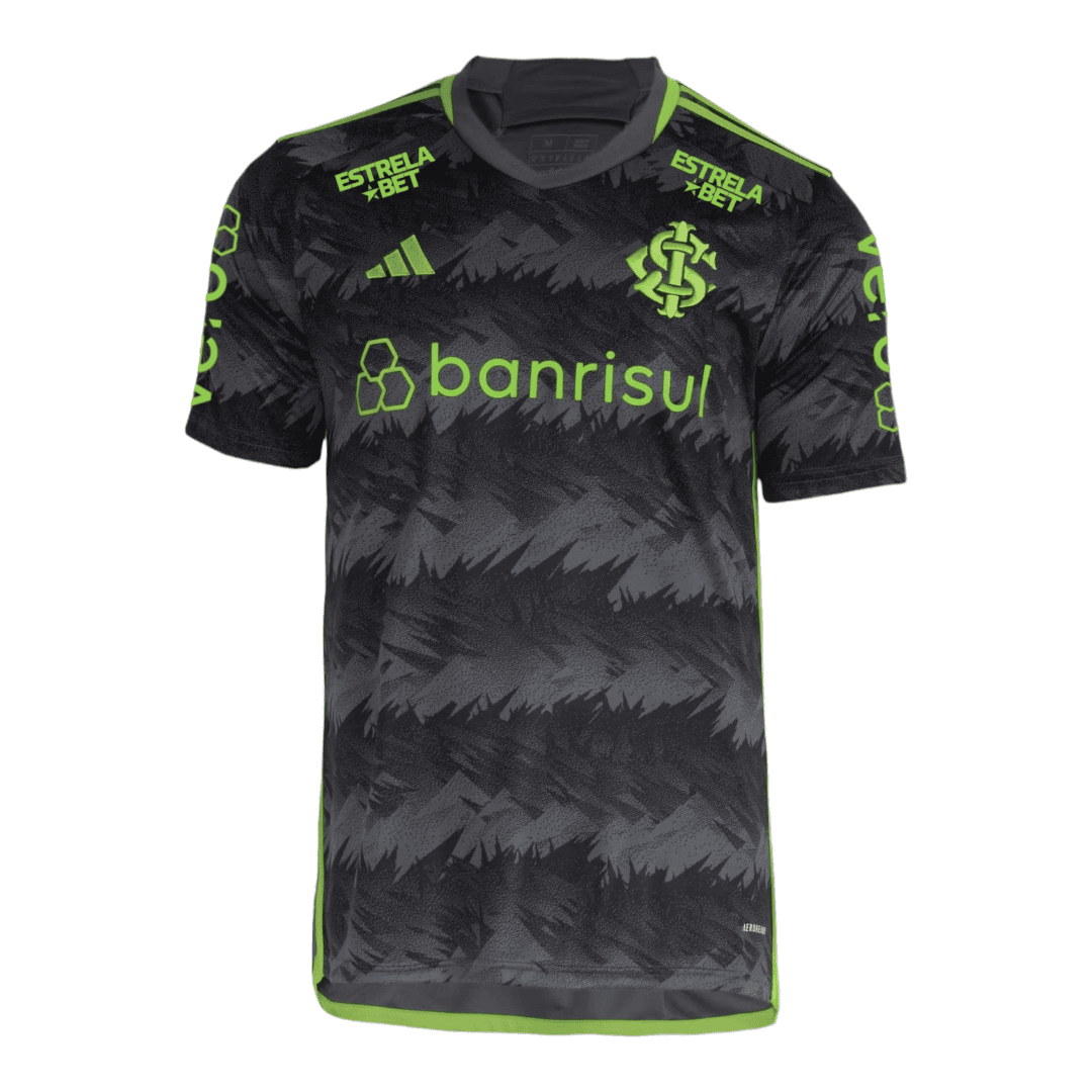 PhotoRoom-20231013-071058_c21ec6cc-7c1d-4562-a197-76e119793d81 | UAE SPORT STORE Black and gray camouflage-style soccer jersey with neon green piping and sponsor logos (Banrisul, Estrela Bet) across the chest and shoulders.