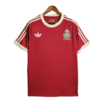 Red Adidas football jersey on a hanger with white collar and sleeves, three white stripes on the shoulders, crest on left chest, and Adidas logo on right chest.