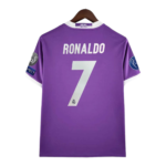 Purple Real Madrid football jersey with 'RONALDO' and the number 7 on the back, hanging on a wooden hanger.