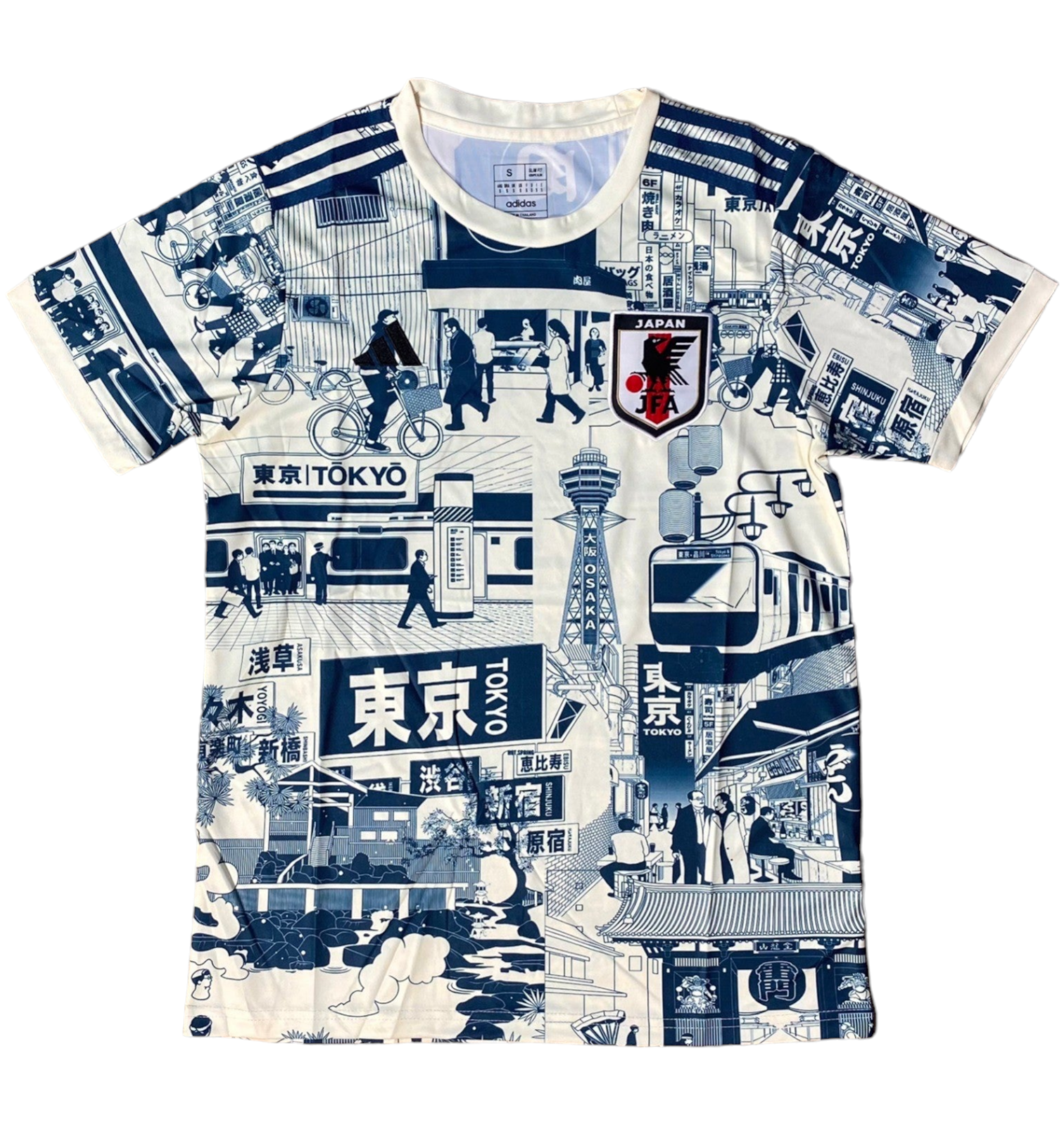Patterned shirt with navy-and-white Tokyo street-scene illustrations, signs, trains, and a Japan emblem.