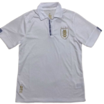 White polo shirt with blue striped placket and sleeve stripes, left chest crest of a shield with stars.