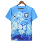 Blue soccer jersey on a wooden hanger featuring a geometric lion design, with a Nike swoosh and a shield crest with a lion.