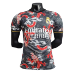 Real Madrid football jersey on a black mannequin, featuring red dragon graphics and the 'Emirates Fly Better' sponsor logo.