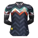 Photoroom-20240530-223737 | UAE SPORT STORE Dark chevron-patterned soccer jersey with green/teal and orange chevrons and a crest on the left chest.