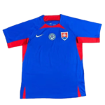 Blue football jersey with red side panels, Nike swoosh, and a shield crest on the chest (Slovakia-style).