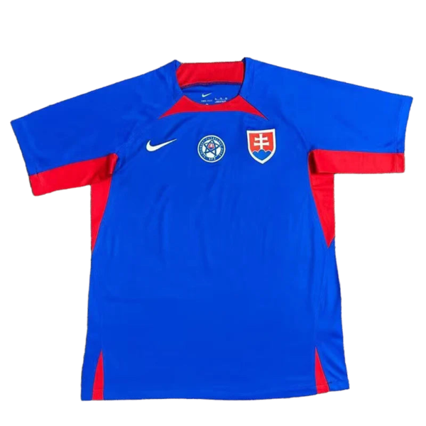 Blue football jersey with red side panels, Nike swoosh, and a shield crest on the chest (Slovakia-style).